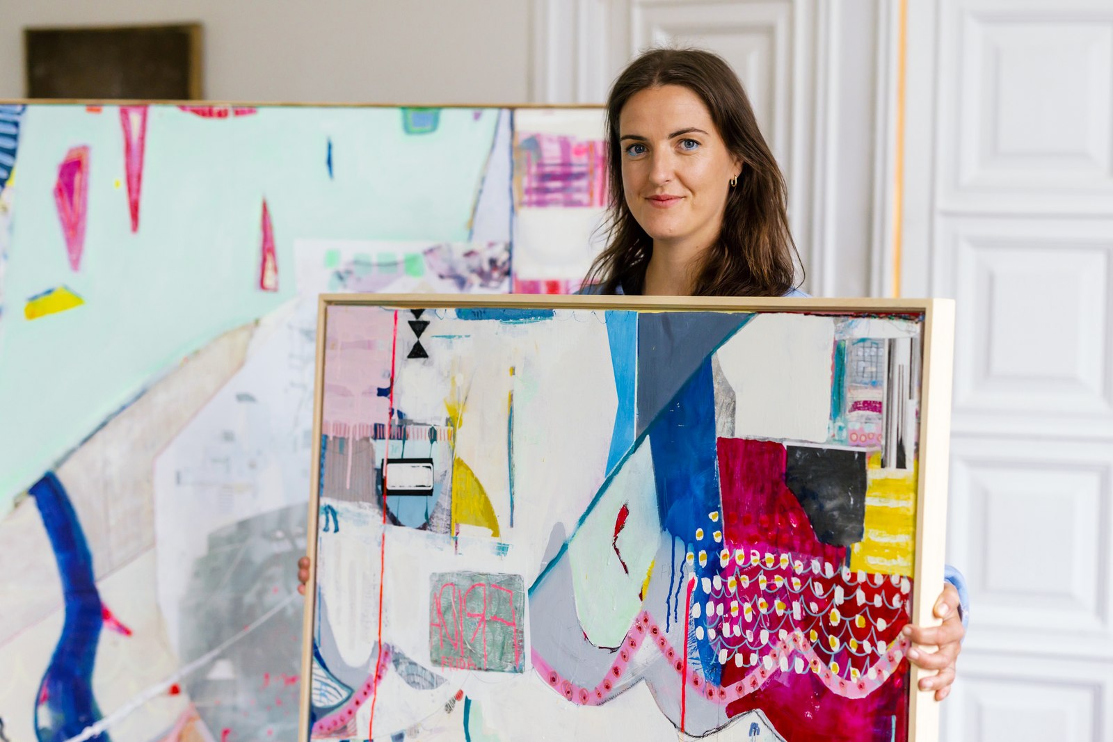 Fiona Dick with a painting from HOW SHE PLAYS
