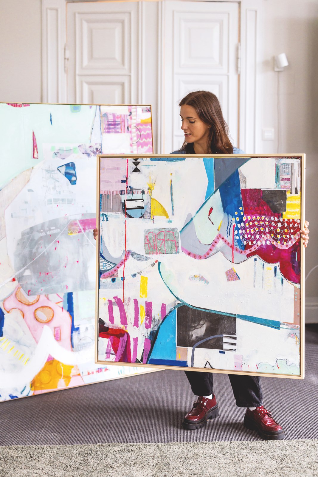 Fiona Dick carrying a painting